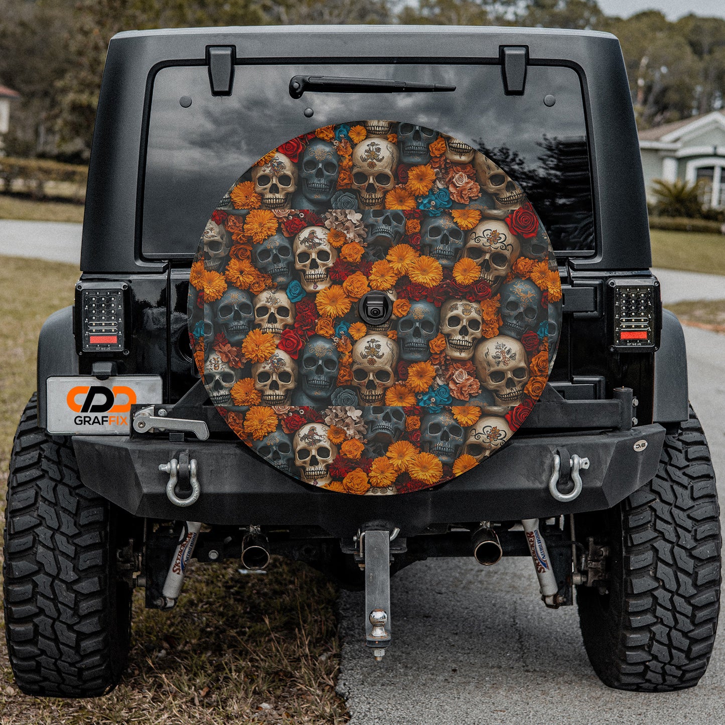 a black jeep with skulls and flowers on it