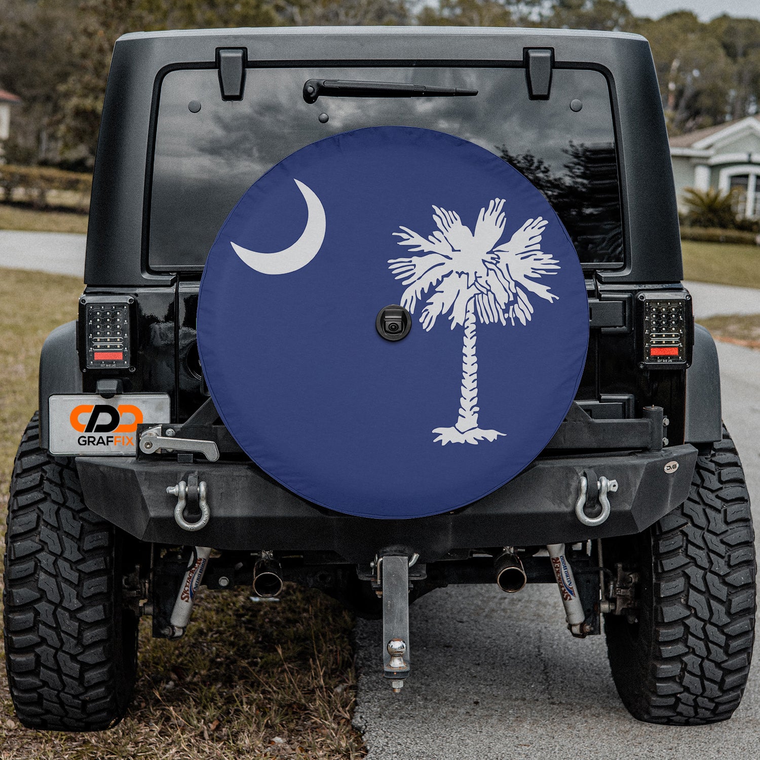 a car with a palm tree and a crescent moon painted on it
