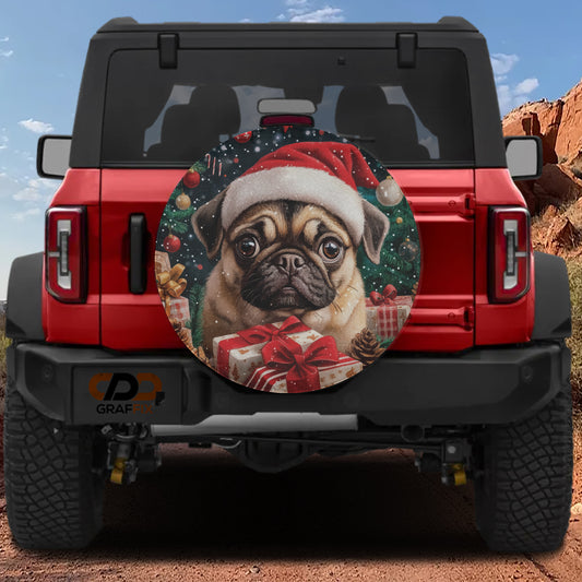 A red Jeep Wrangler with a large Christmas-themed spare tire on the back, featuring a pug dog wearing a Santa hat and holding presents.