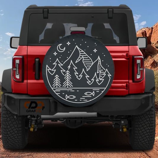 the rear view of a red Jeep Wrangler with a large black tire cover featuring a mountain landscape and night sky design.