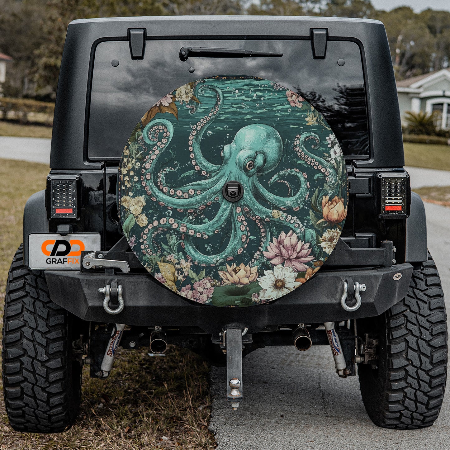the back of a black Jeep Wrangler with a large, colorful octopus-themed spare tire attached to it.