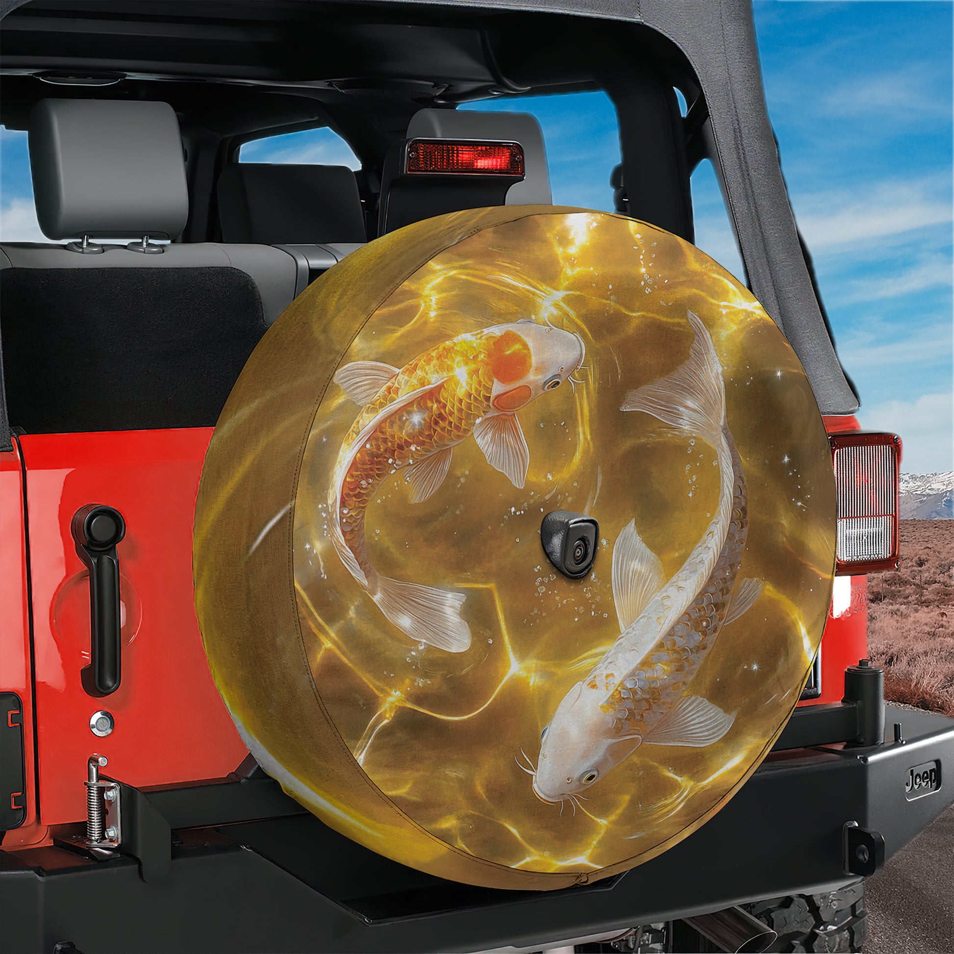 A large, round spare tire cover with a fish design on it, mounted on the rear of a red Jeep.