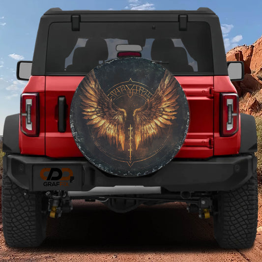A red Jeep Wrangler with a large winged wheel cover on the rear.