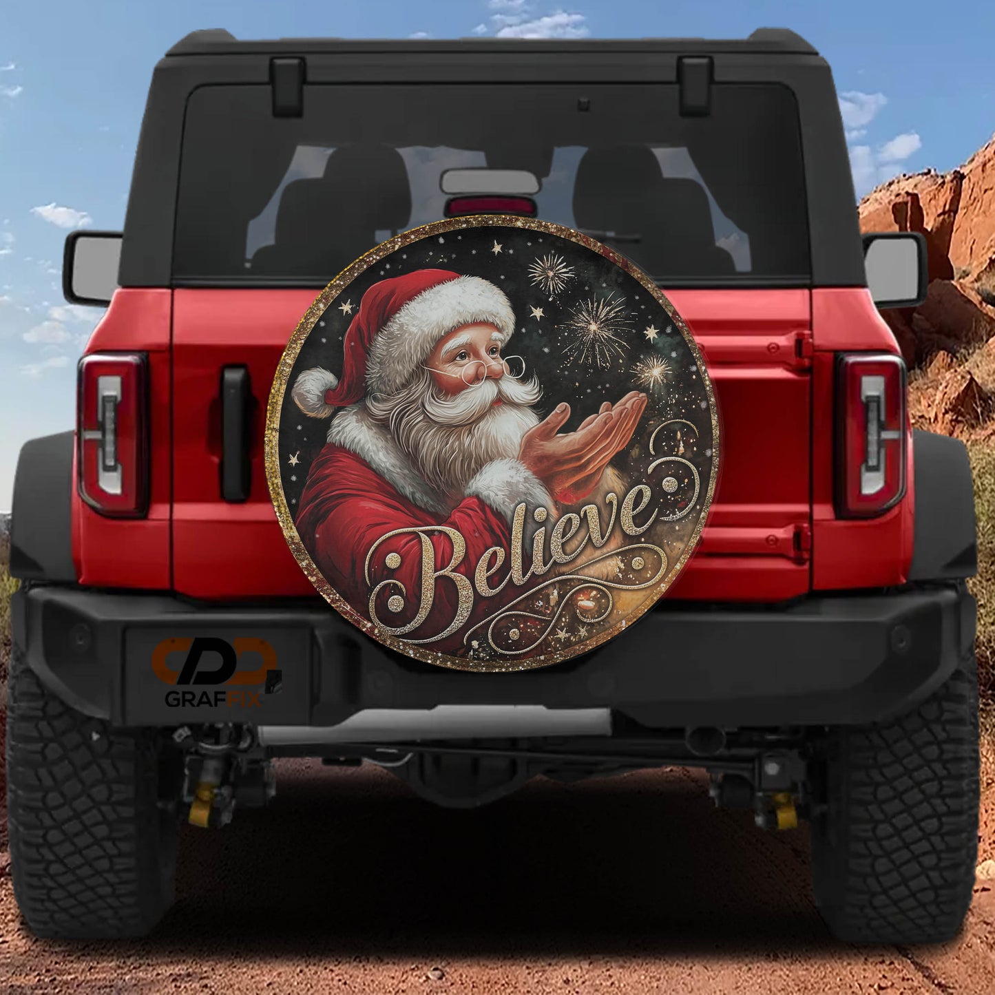 a red Jeep Wrangler with a large, decorative wheel cover featuring a picture of Santa Claus and the word "Believe" written on it.