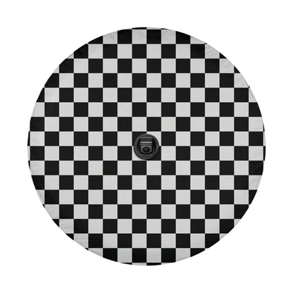a black and white checkered pattern on a round surface.