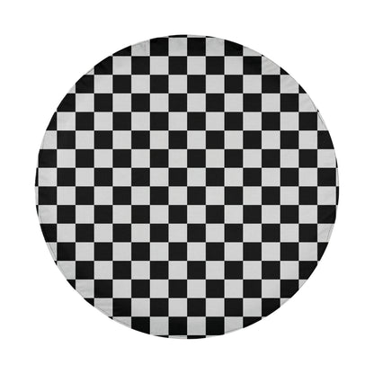 A round, white object with a black and white checkered pattern covering its surface.