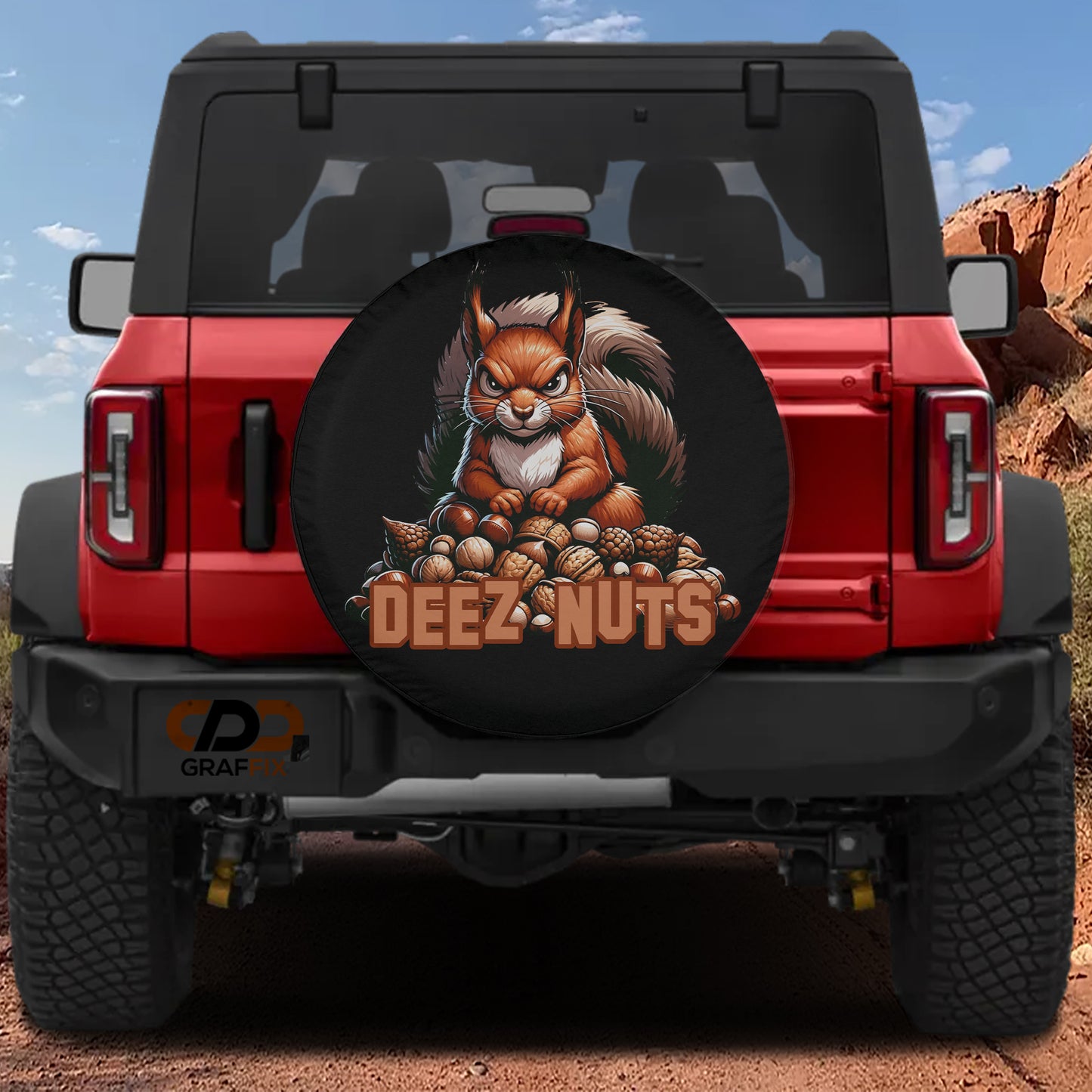 a red Jeep Wrangler with a large tire cover featuring a cartoon squirrel and the text "DEEZ NUTS" on the rear of the vehicle.