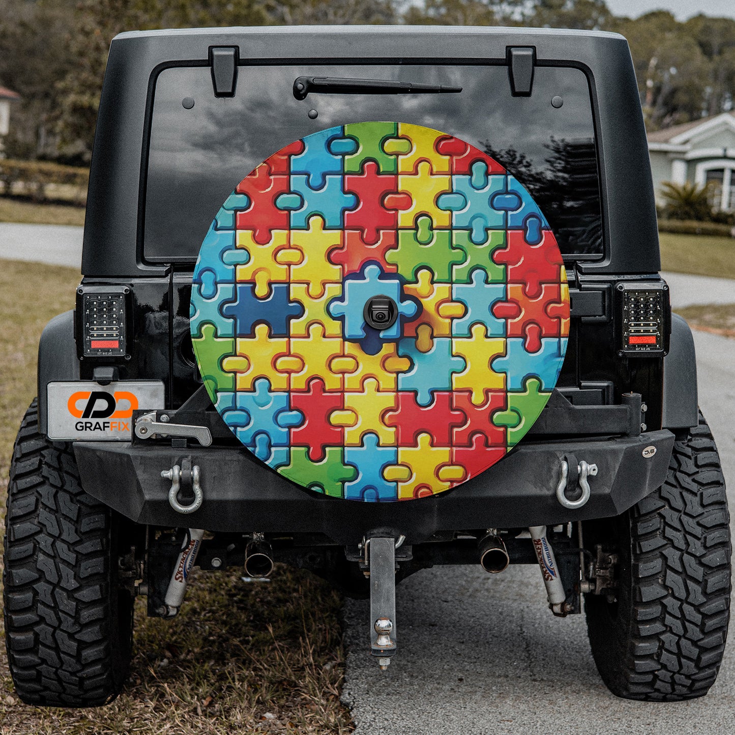 a jeep with a colorful puzzle design on the front of it