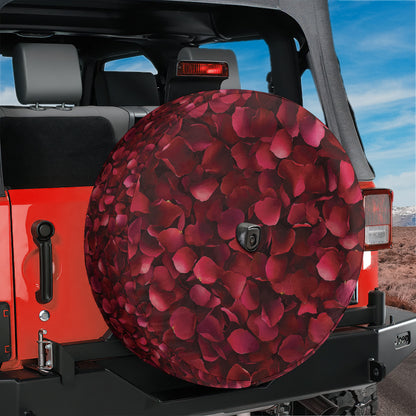 A red Jeep Wrangler with a rose-patterned spare tire cover attached to the rear of the vehicle.