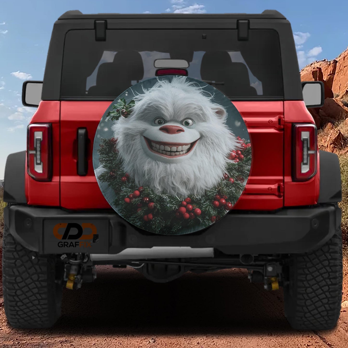 a red Jeep Wrangler with a large, round spare tire cover that has a cartoon character on it.