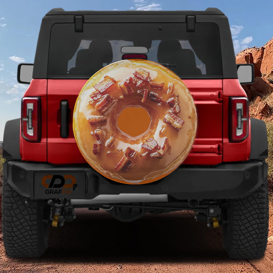 A red Jeep Wrangler with a large donut-shaped spare tire attached to the rear.