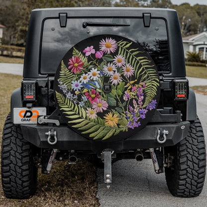a black Jeep Wrangler with a large floral decal on the rear window.