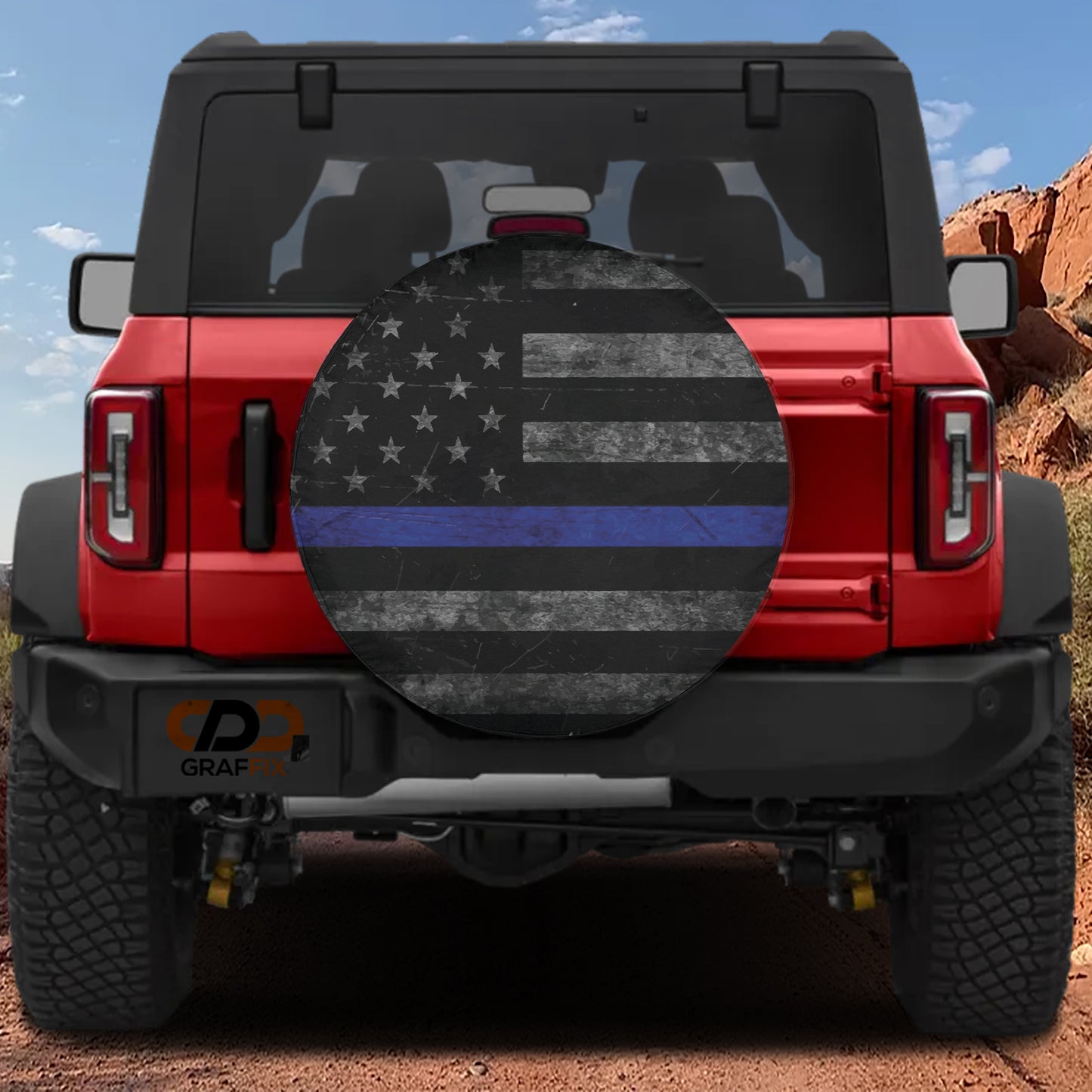 the back of a red Jeep Wrangler with a large American flag decal on the rear window.