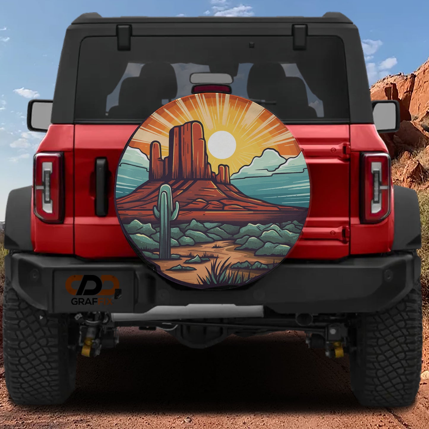 a red Jeep Wrangler with a large graphic of a desert landscape on the rear window.