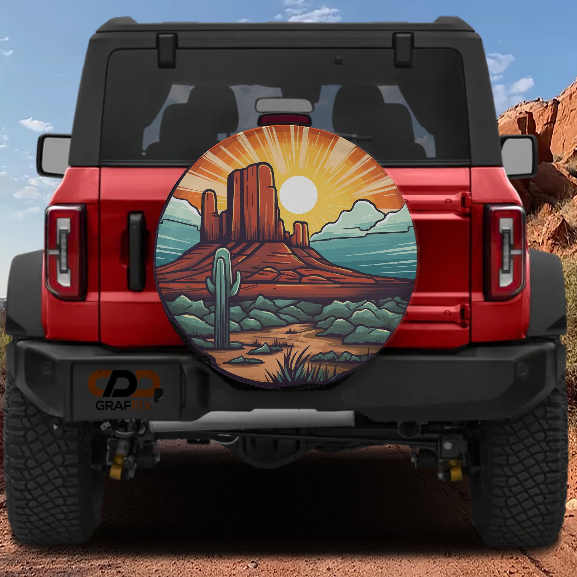 a red Jeep Wrangler with a large graphic of a desert landscape on the rear window.