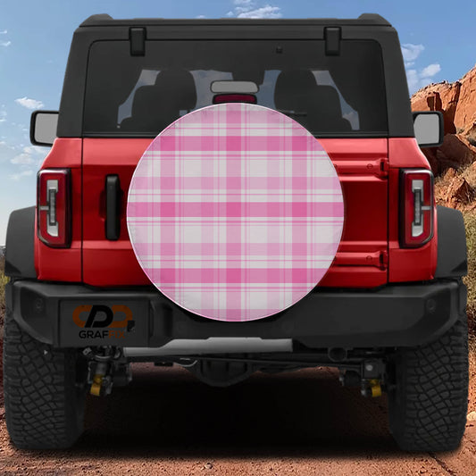 the rear view of a red Jeep Wrangler with a large pink and white checkered cover attached to the rear.