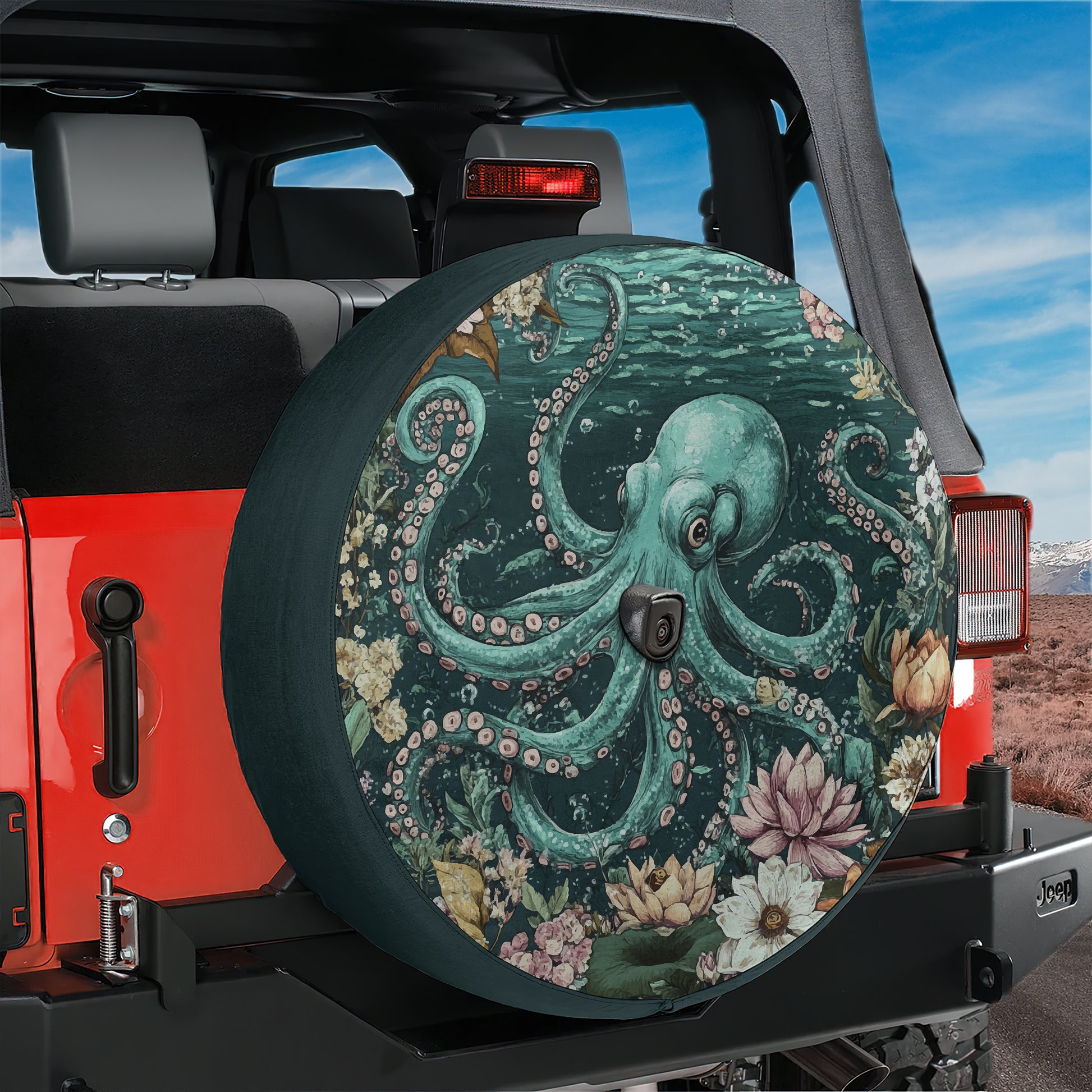 A large, colorful octopus-themed spare tire cover is attached to the rear of a red Jeep vehicle, with a desert landscape visible in the background.