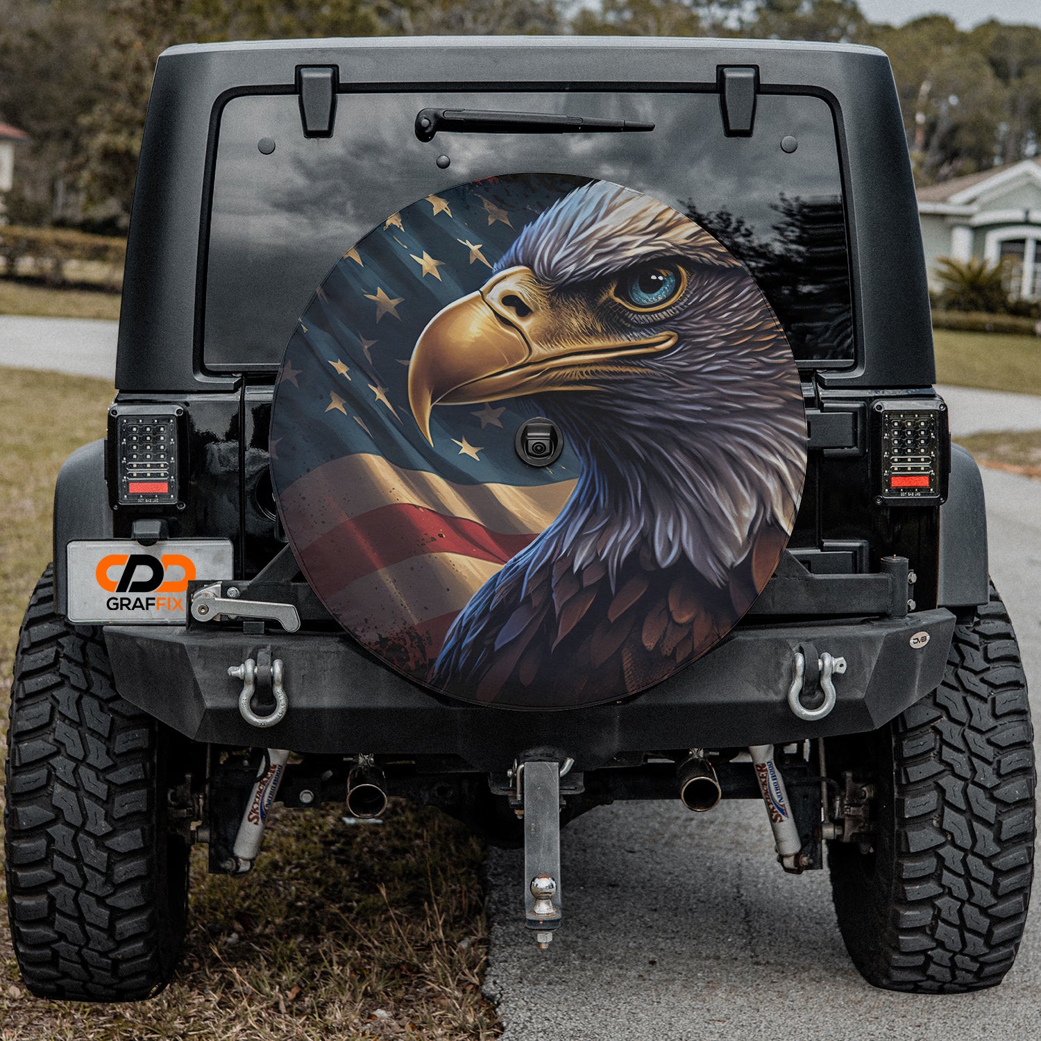 an eagle painted on the back of a jeep