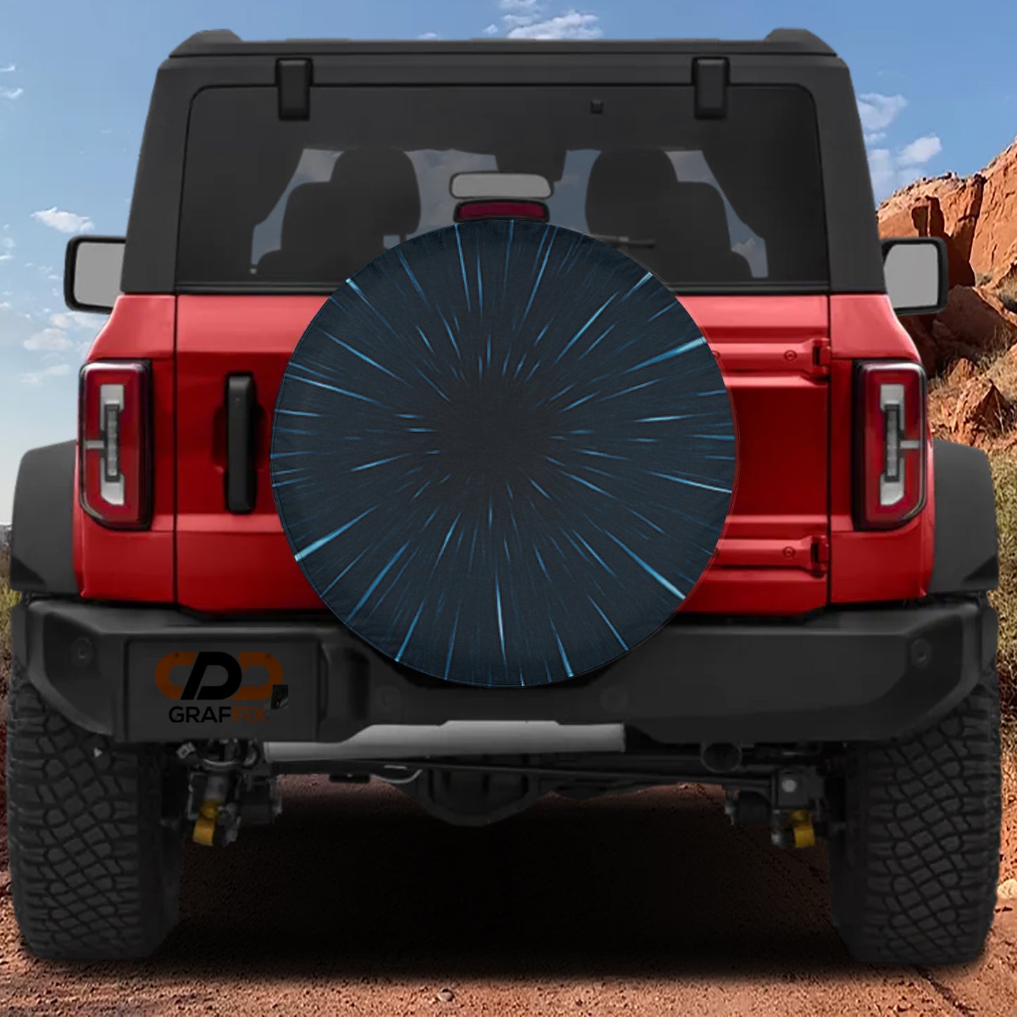 the rear view of a red Jeep Wrangler with a large black tire cover on the back.