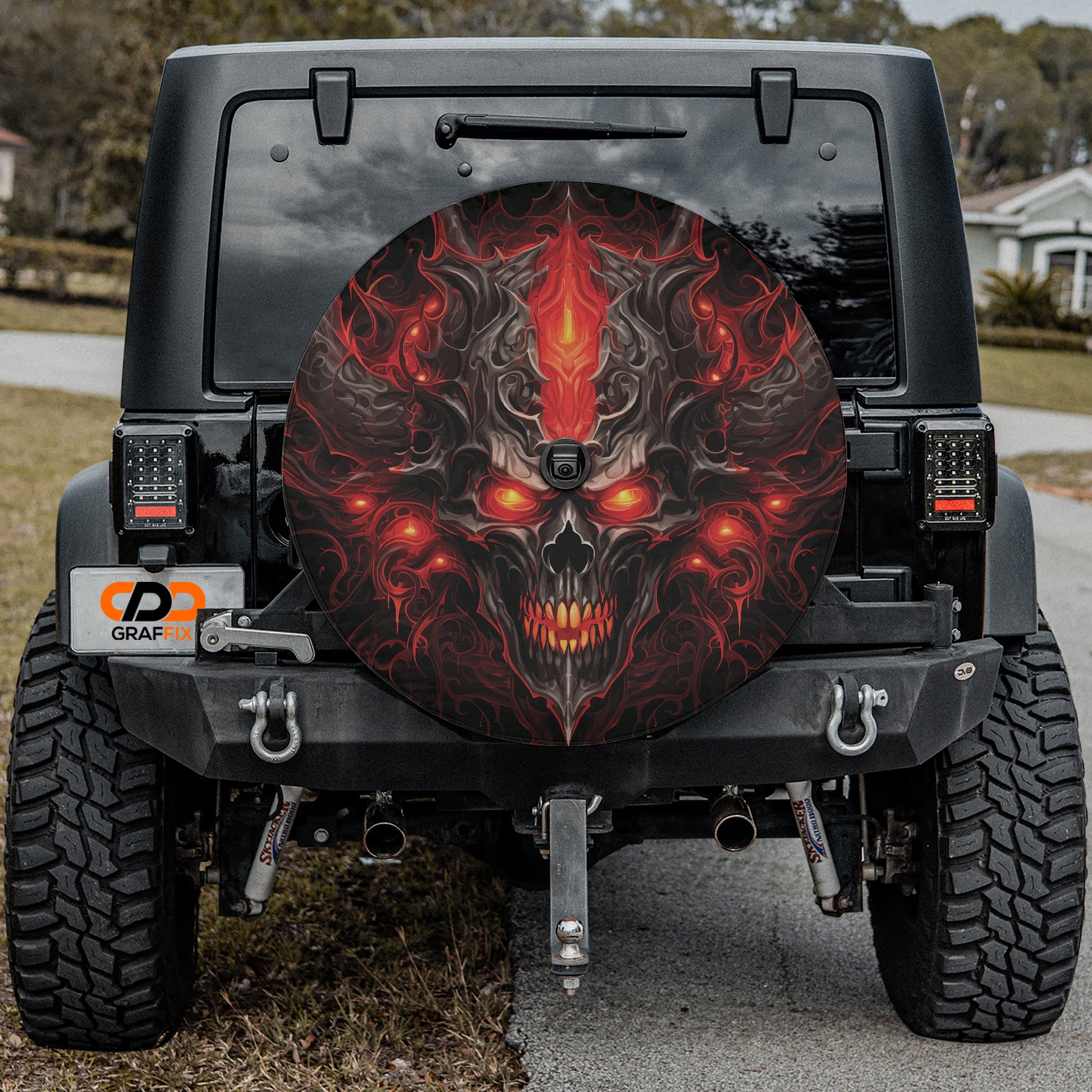 a jeep with a skull painted on the side of it
