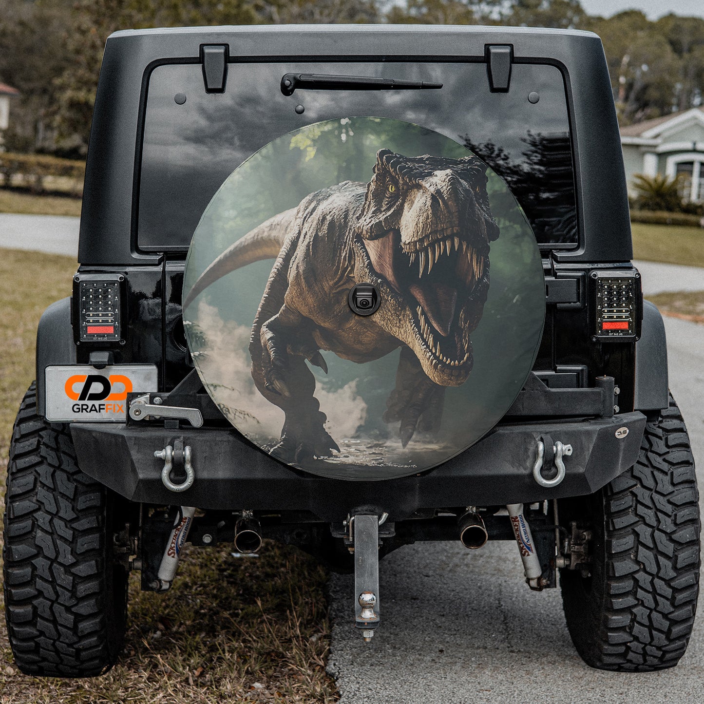 a picture of a dinosaur on the back of a jeep