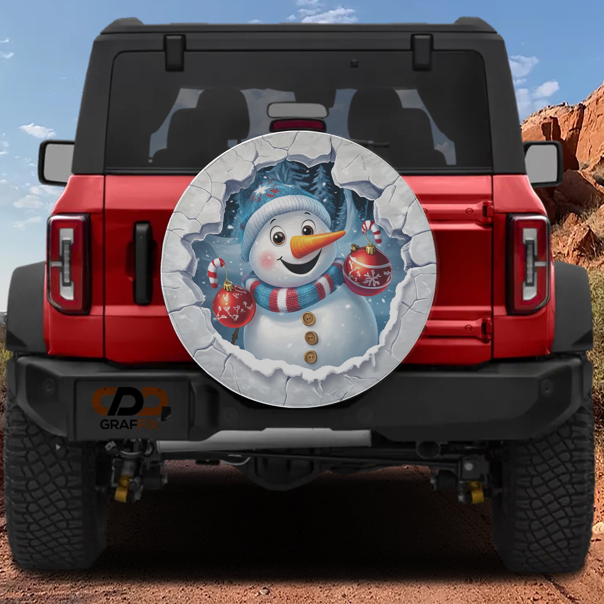 A red Jeep Wrangler with a snowman decal on the rear window.