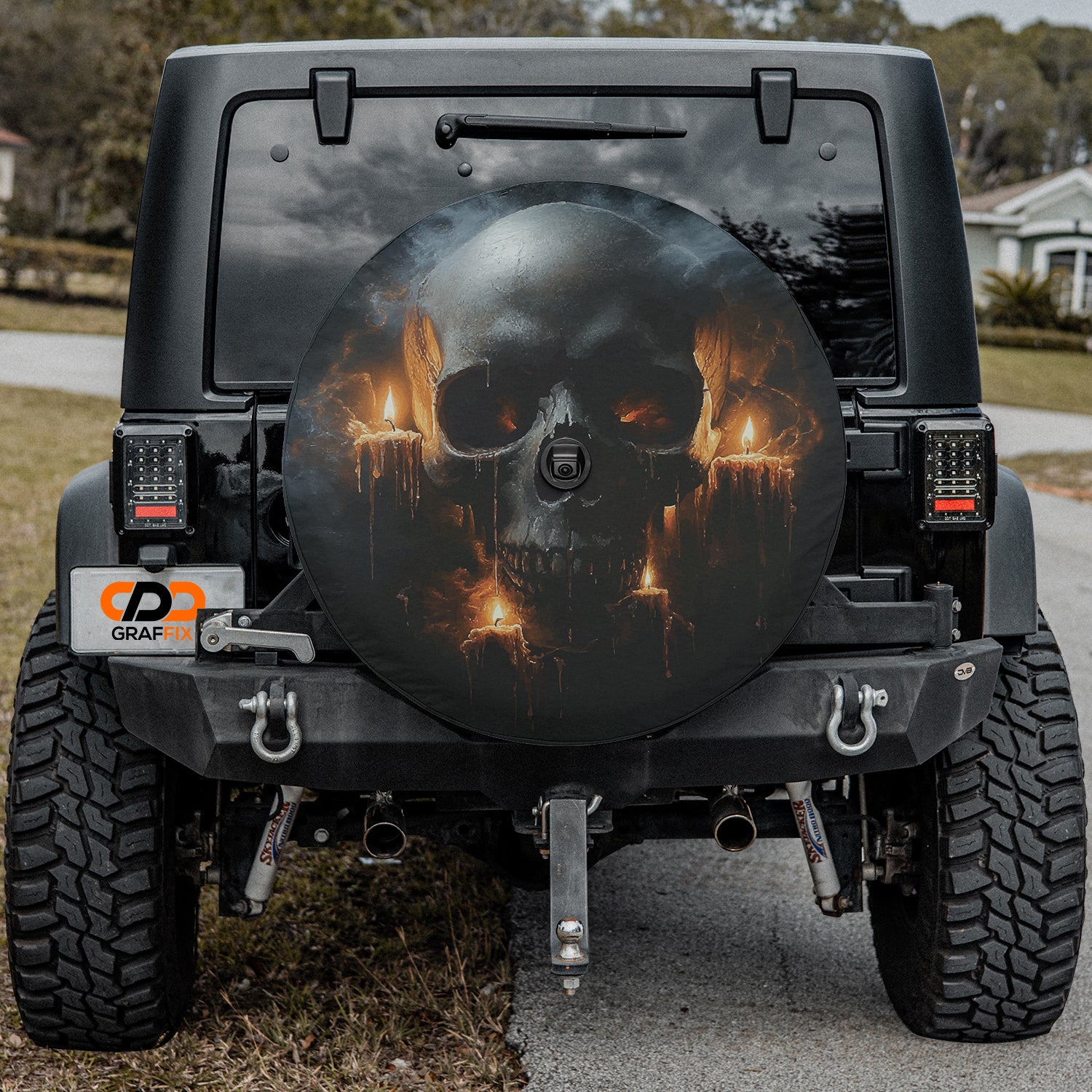 a black jeep with a picture of a skull on it