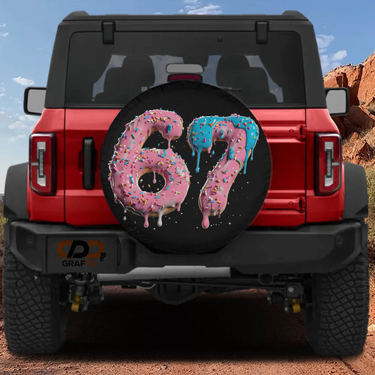 A red Jeep Wrangler with a large tire cover featuring the number "67" in pink and blue frosting.