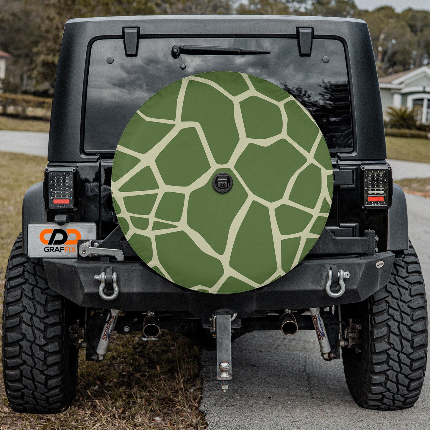 a giraffe print on the back of a jeep