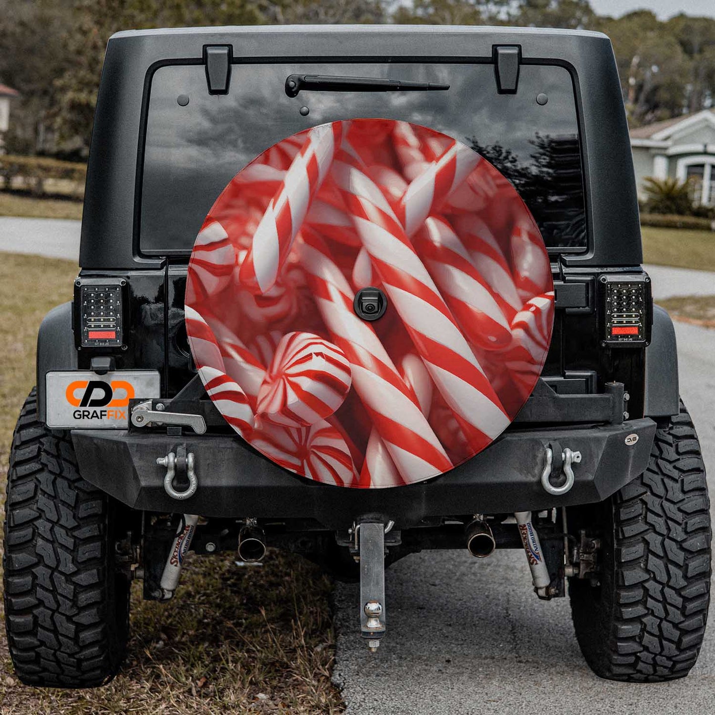 a red and white striped candy cane pattern on the front of a jeep