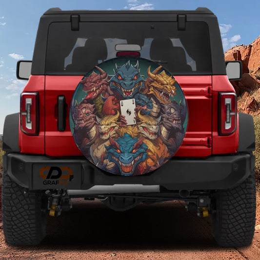 A red Jeep Wrangler with a large, colorful wheel cover featuring a dragon design.