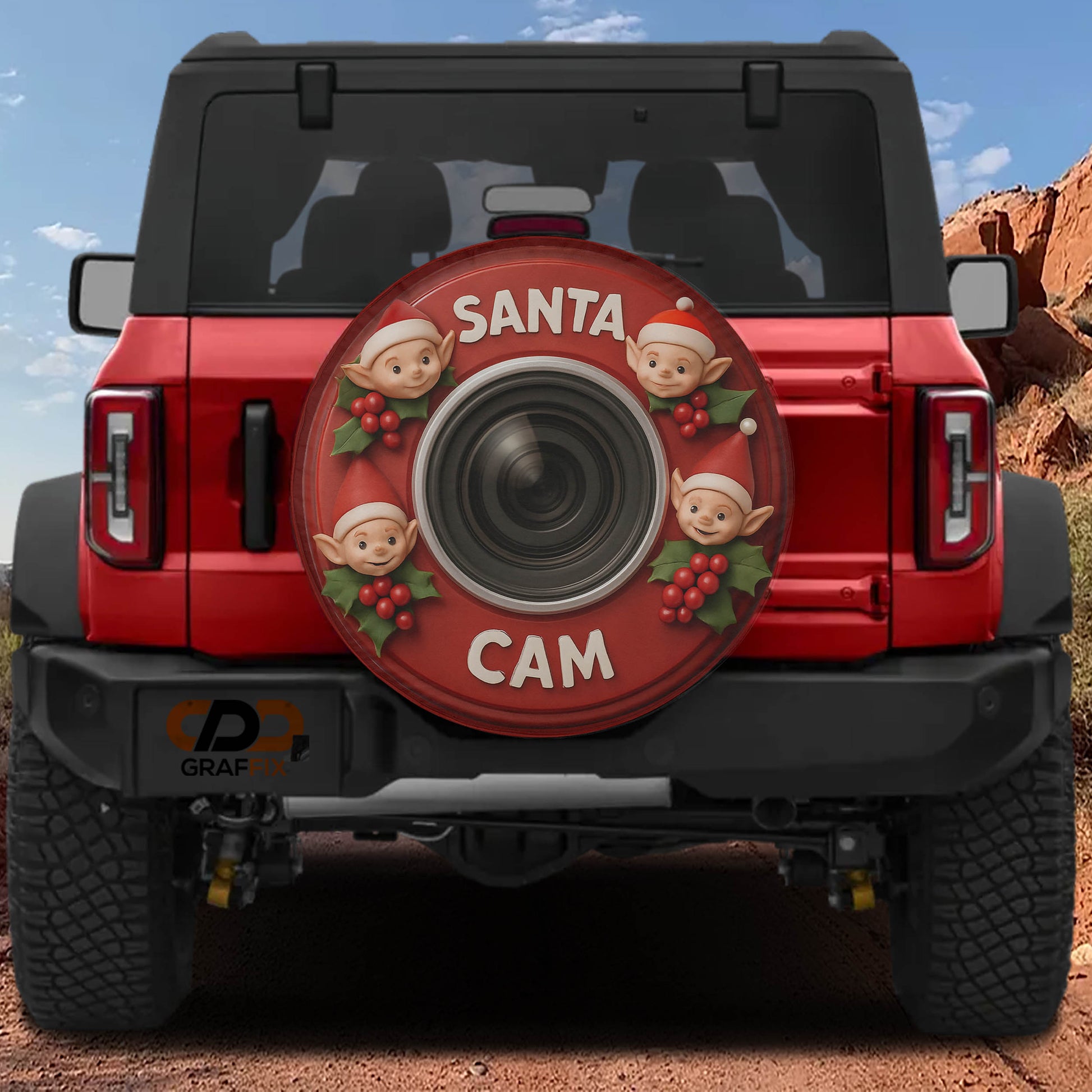 A red Jeep Wrangler with a Santa Claus-themed spare tire cover attached to the rear.