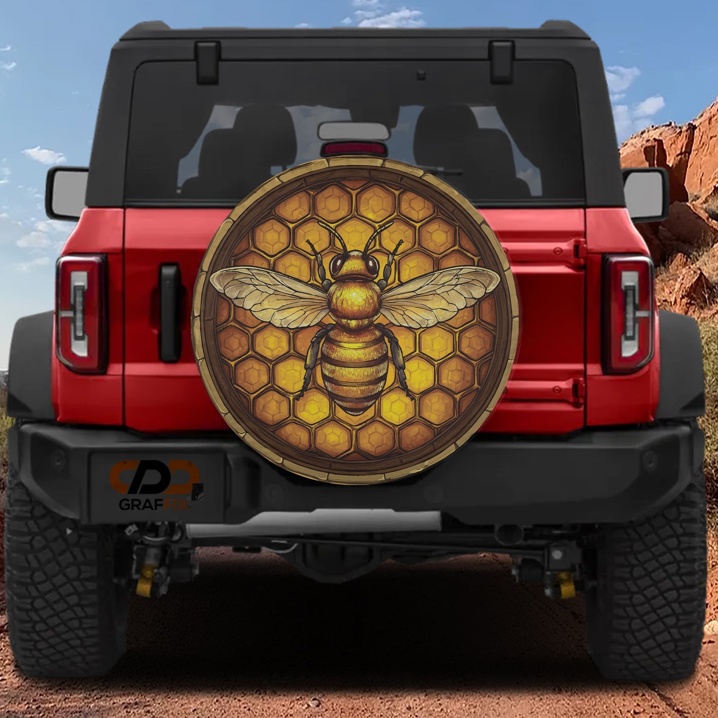 A red Jeep Wrangler with a large honeycomb-patterned decal on the rear window.