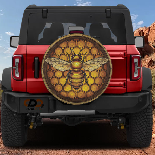 A red Jeep Wrangler with a large honeycomb-patterned decal on the rear window.