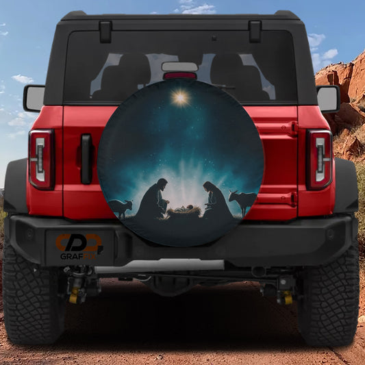 A red Jeep Wrangler with a nativity scene decal on the rear window.