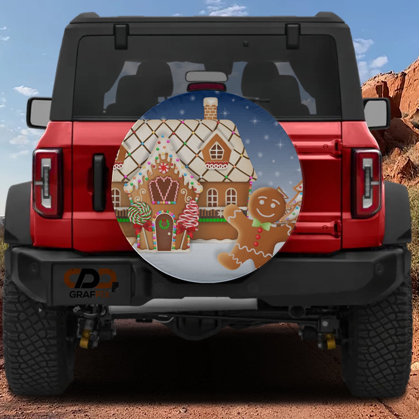 a red Jeep Wrangler with a gingerbread house decal on the rear window.