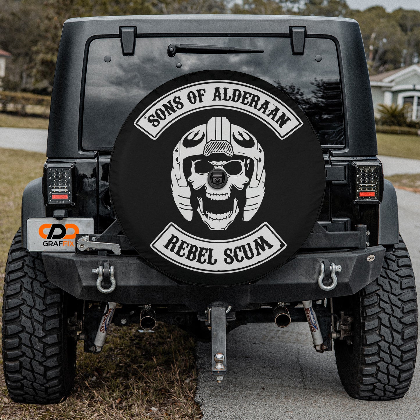 a black jeep with a skull on the back of it