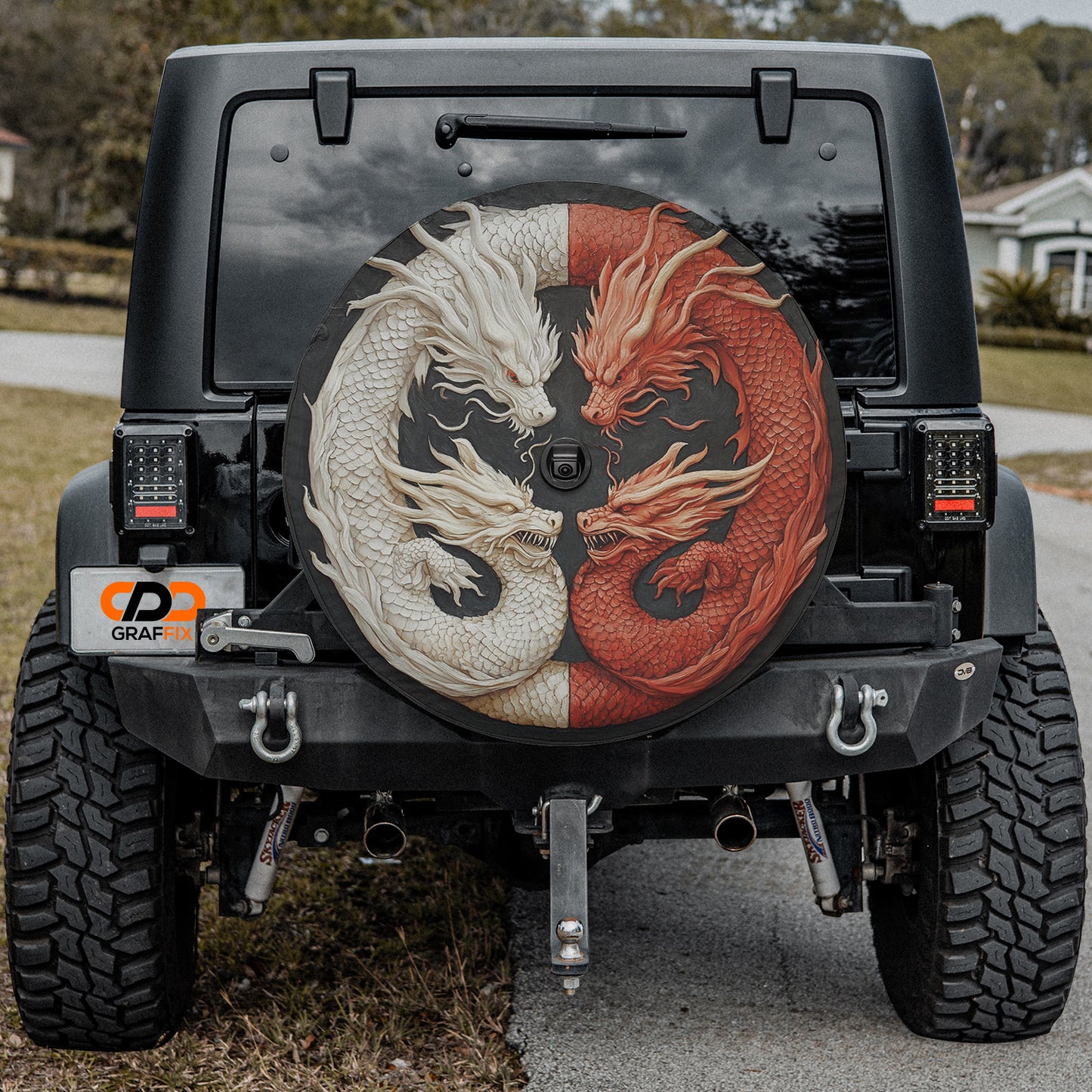 a black jeep with a red dragon and white dragon painted on it