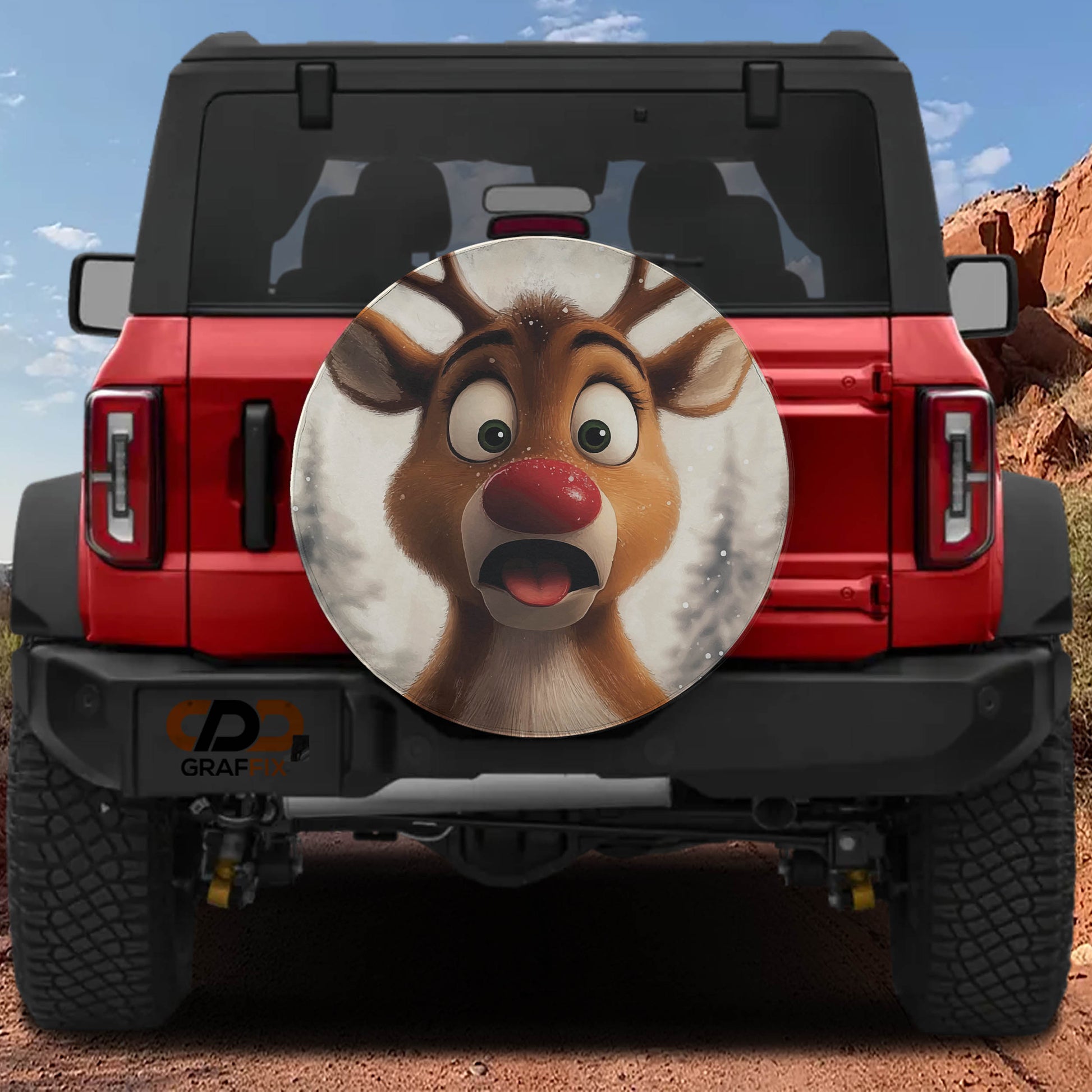 A red Jeep Wrangler with a large deer-like graphic on the rear window.