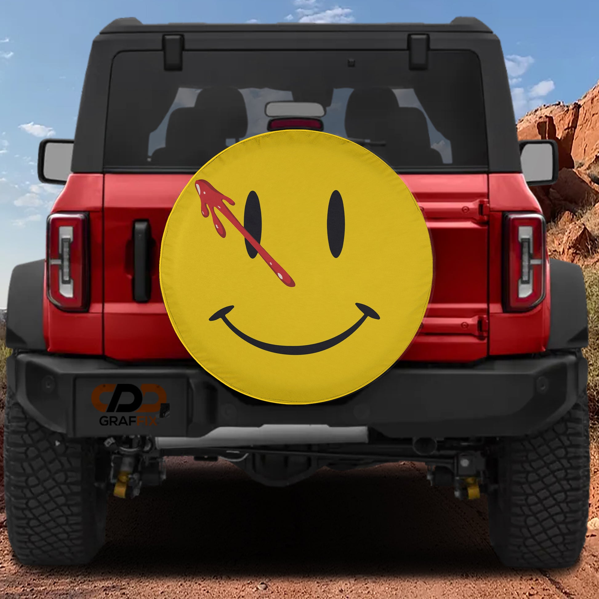 a red Jeep Wrangler with a large yellow smiley face sticker on the rear window.