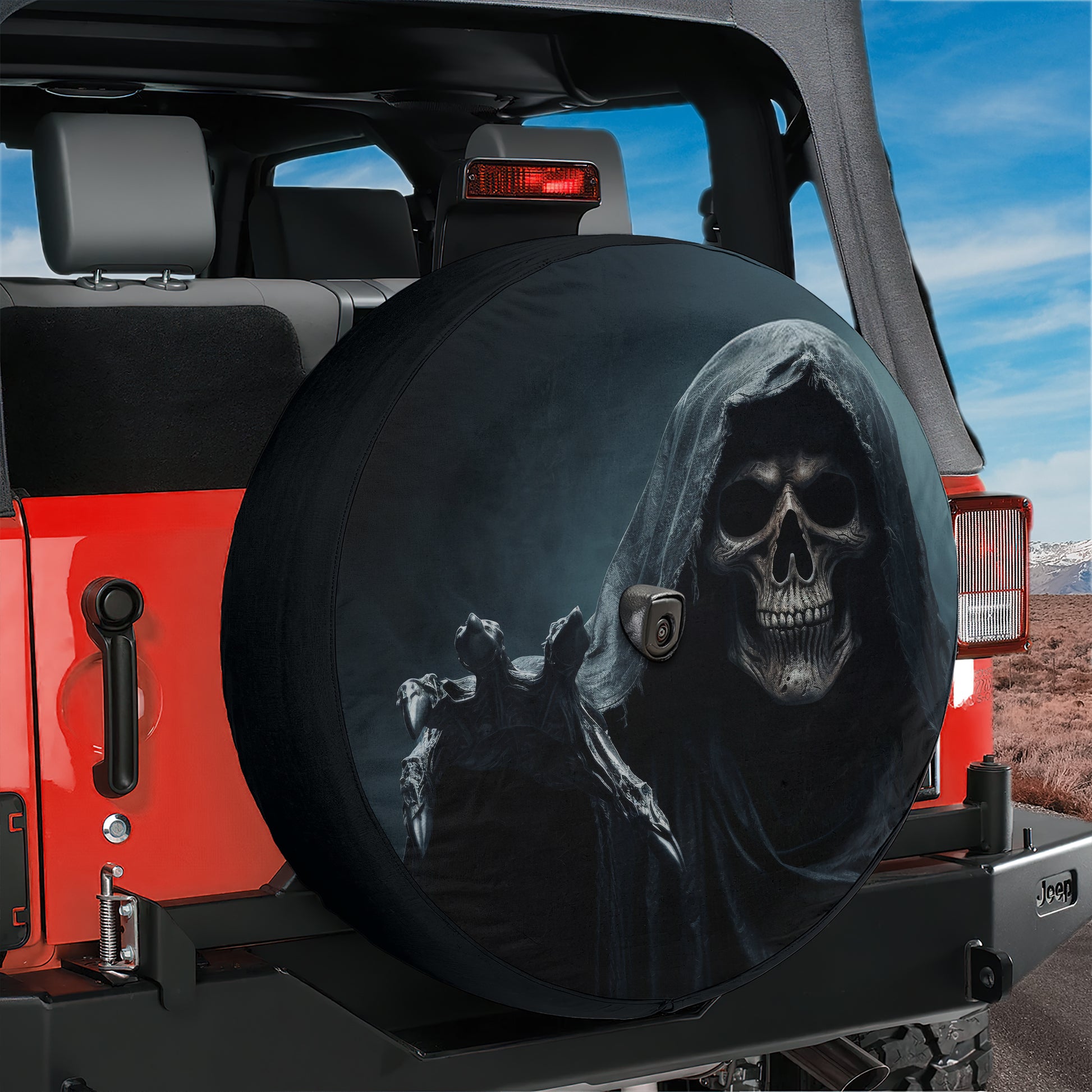 A red Jeep with a skull-themed spare tire cover on the rear of the vehicle.