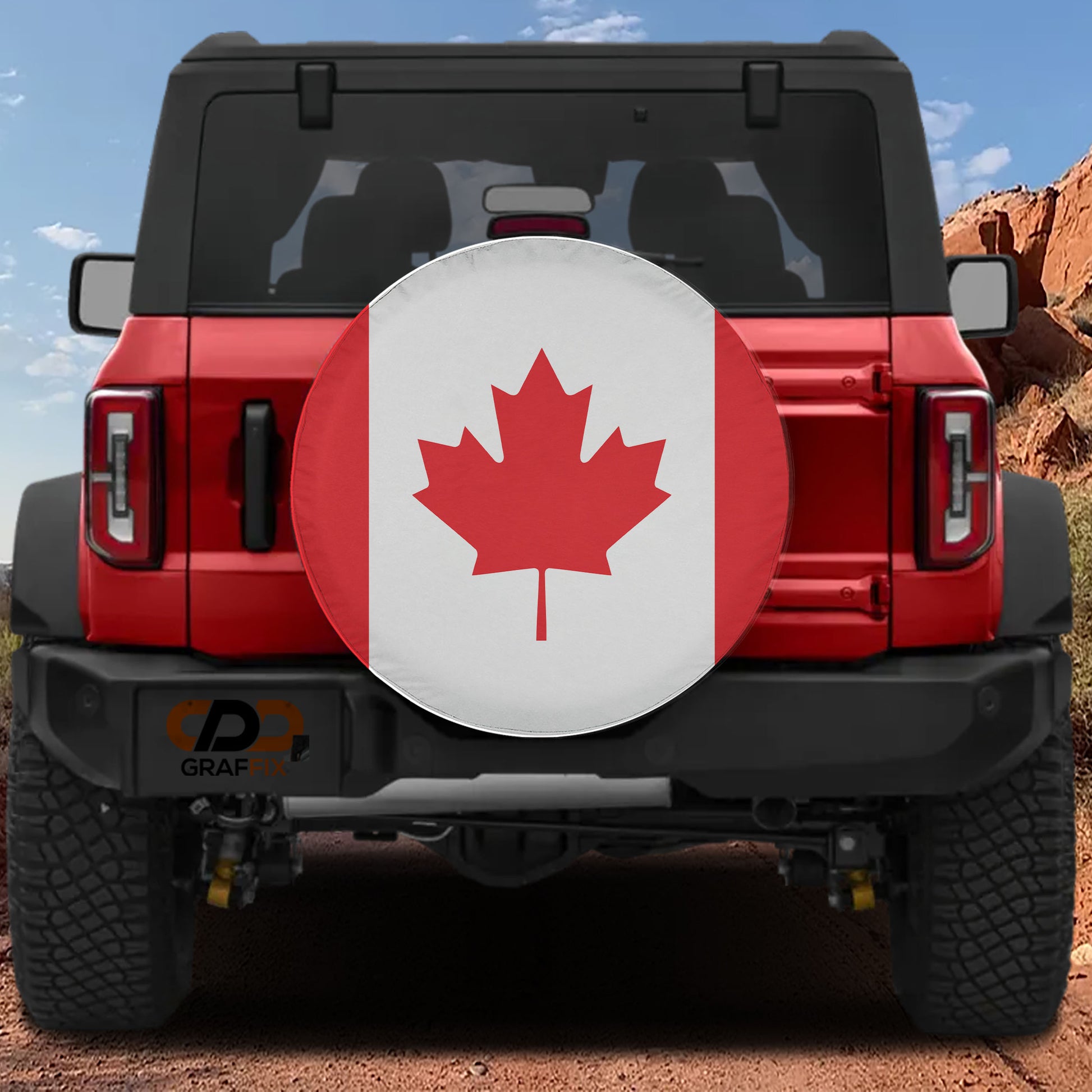 a red Jeep Wrangler with a Canadian flag decal on the rear window.