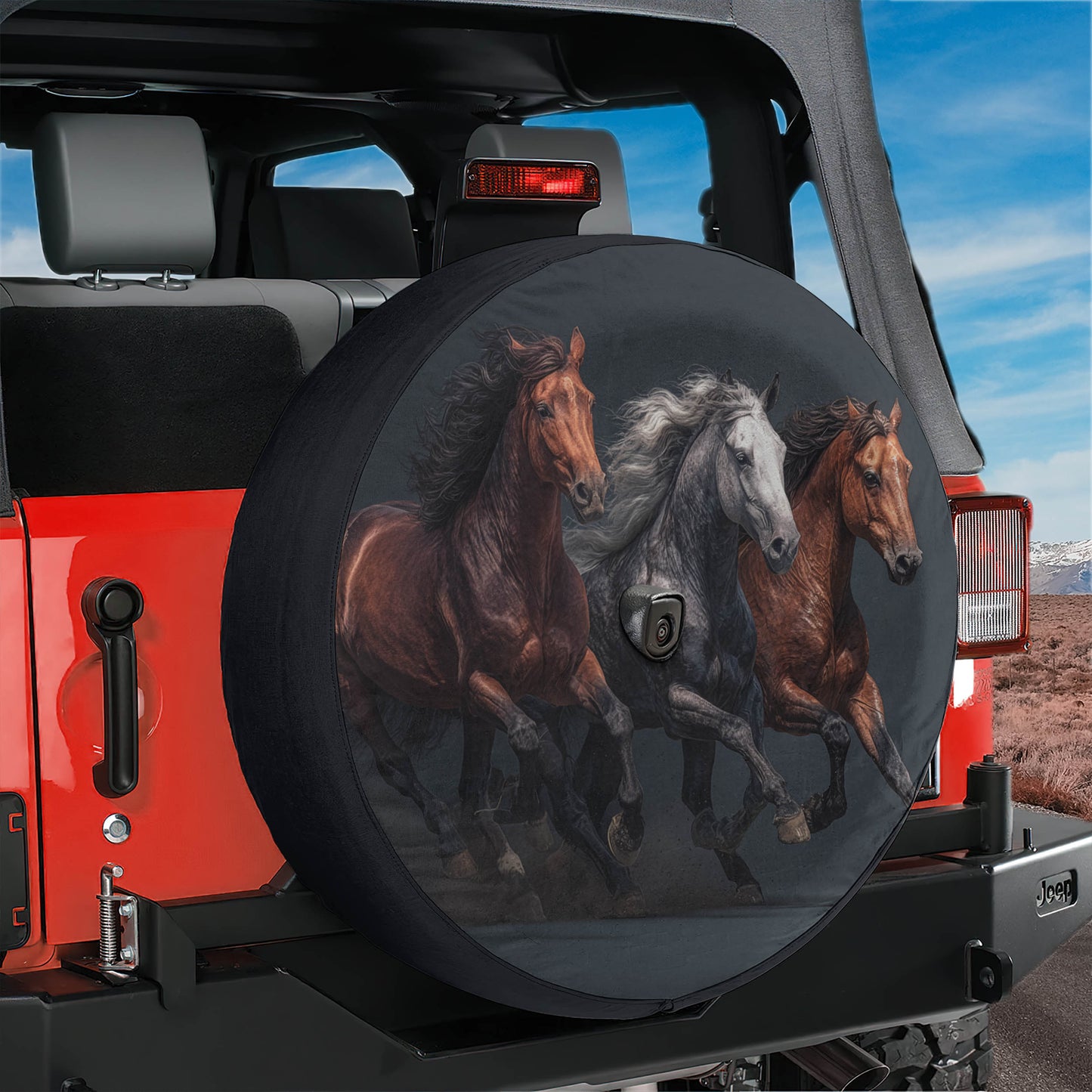 A red Jeep with a black spare tire cover featuring a design of three horses running.