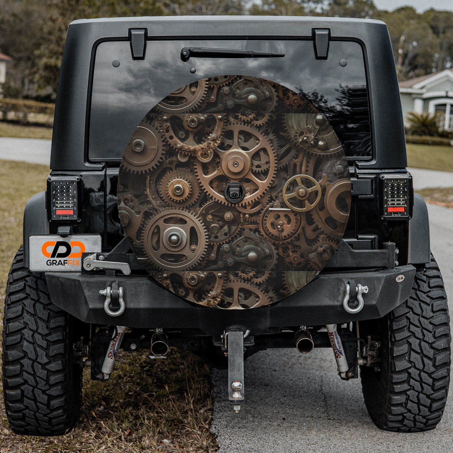 a black jeep with gears on the back of it