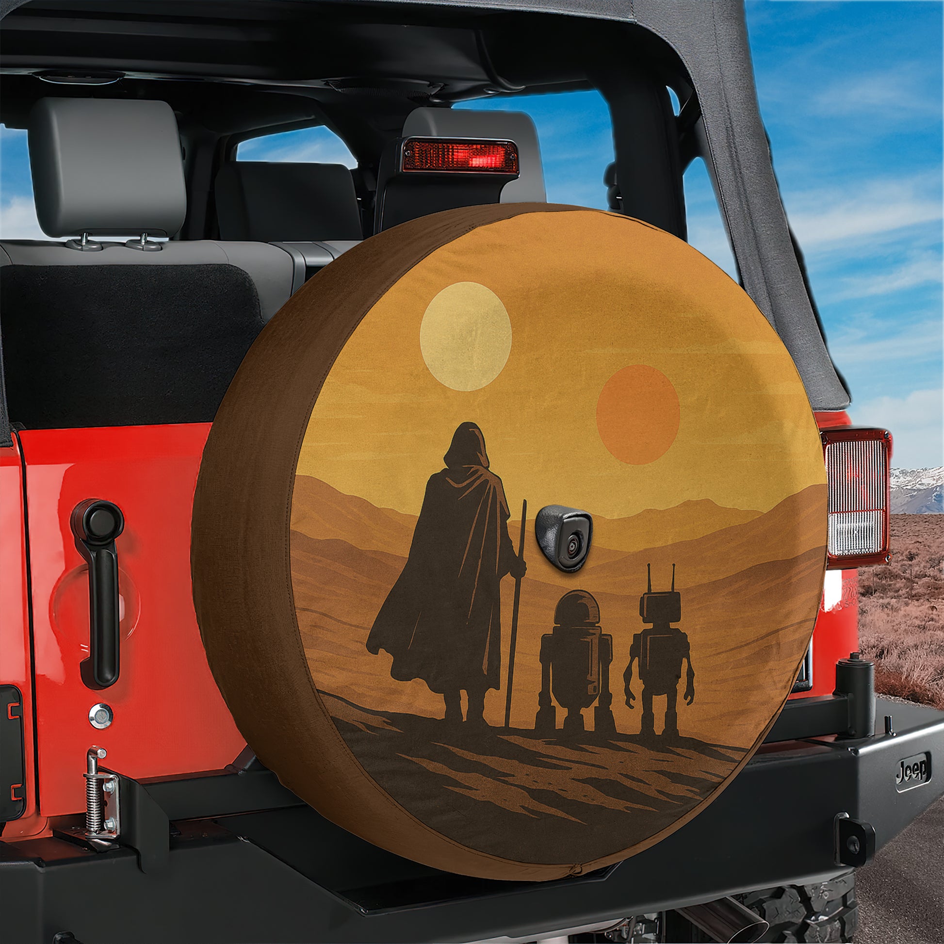 A Jeep vehicle with a spare tire cover featuring a desert scene with three robots, likely referencing the Star Wars universe.