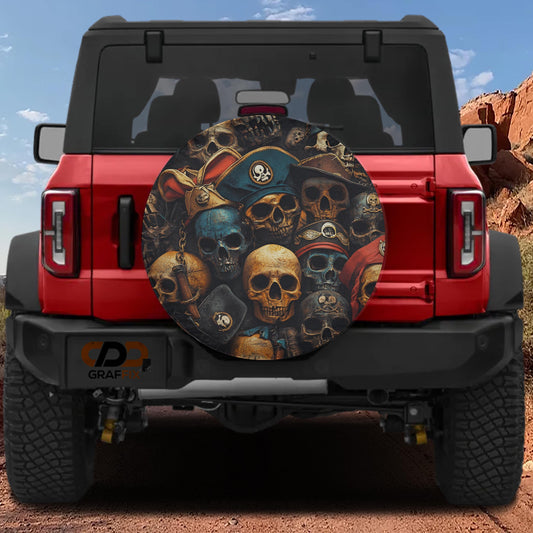 A red Jeep Wrangler with a skull-themed spare tire cover on the rear.