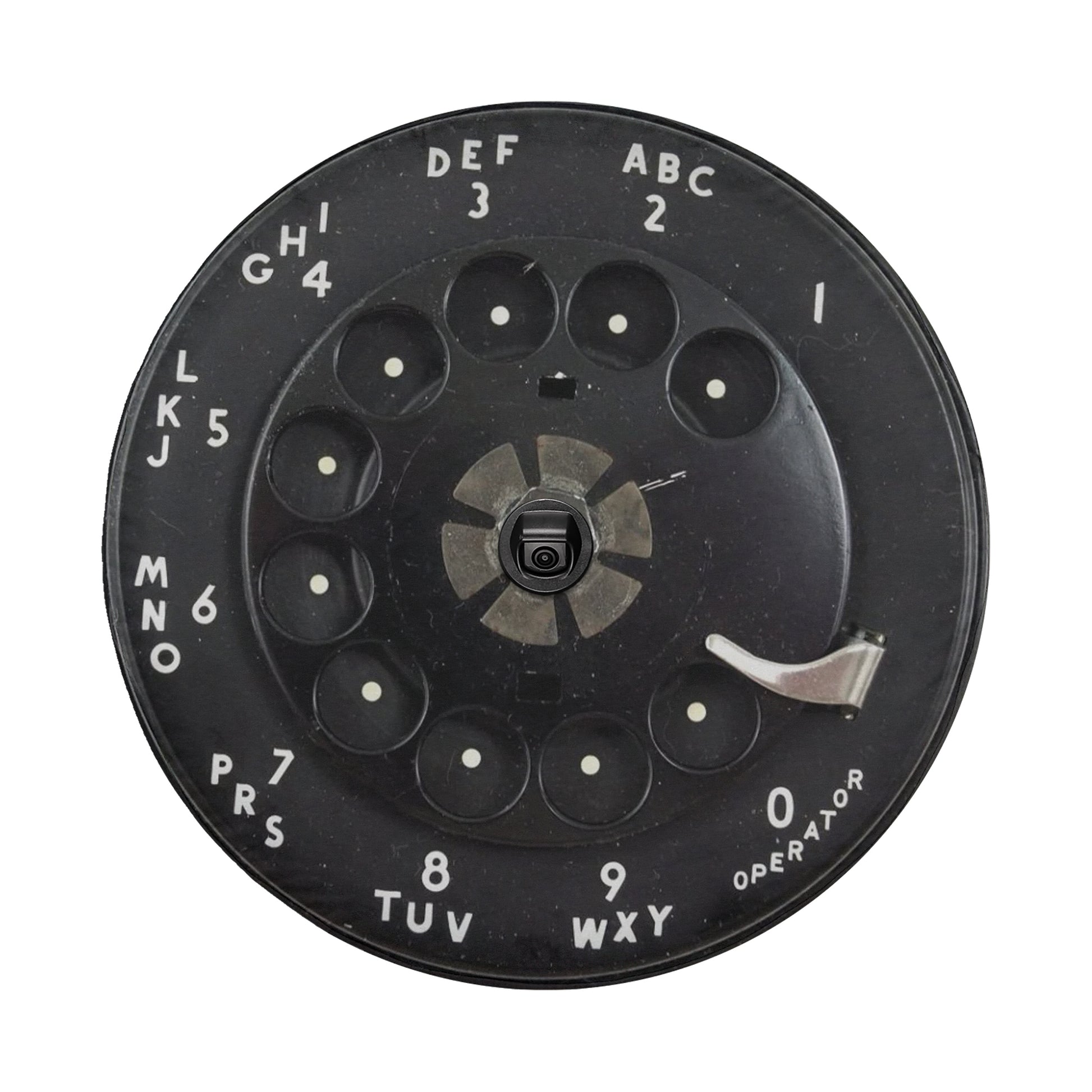 a black dial with white text and numbers, likely representing a telephone keypad.