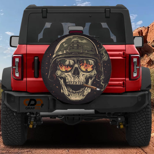 A red Jeep Wrangler with a skull-themed spare tire cover on the rear.