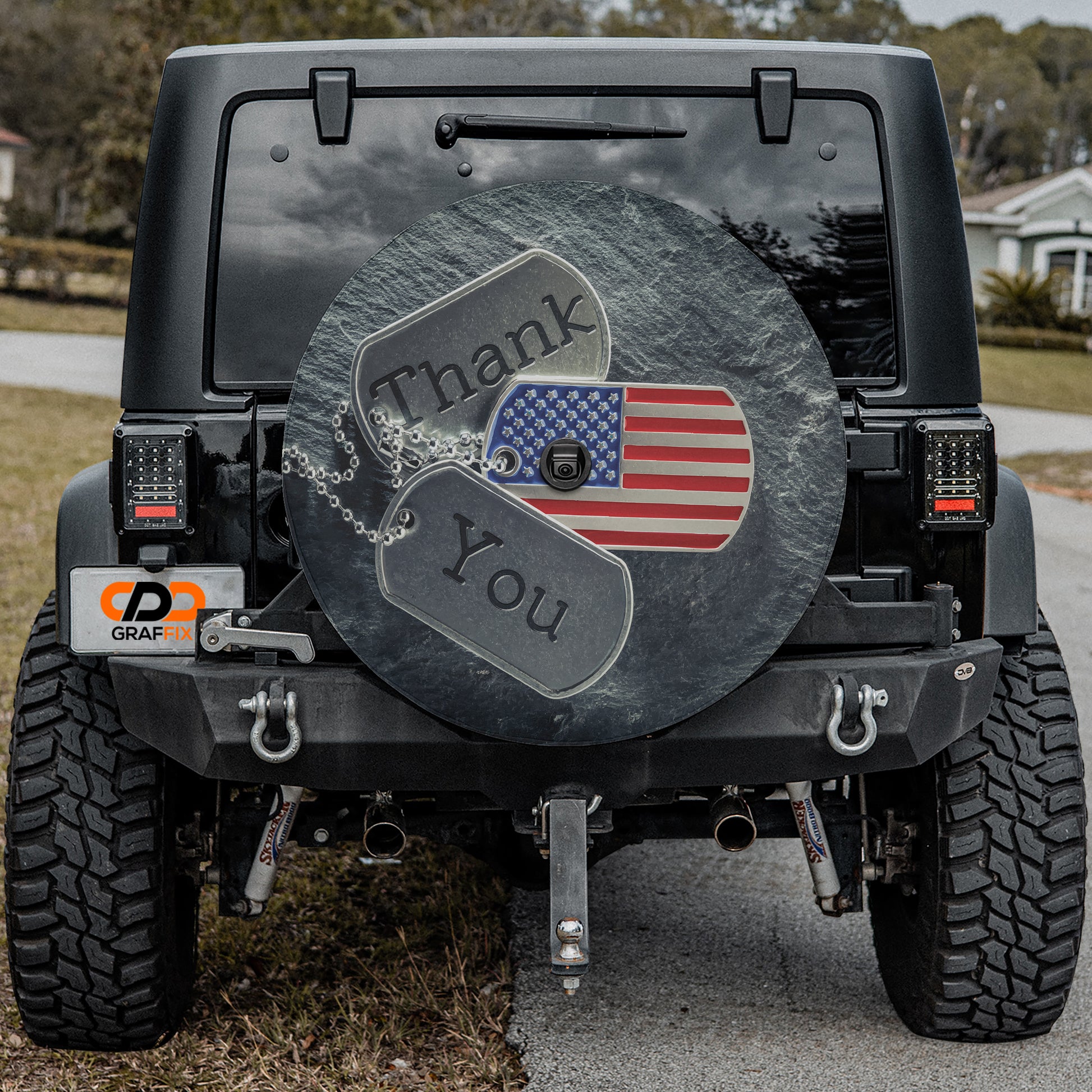 a black jeep with a thank you sign on it