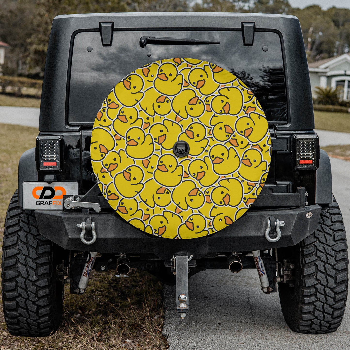 the back of a black Jeep Wrangler with a large yellow duck decal on the rear window.
